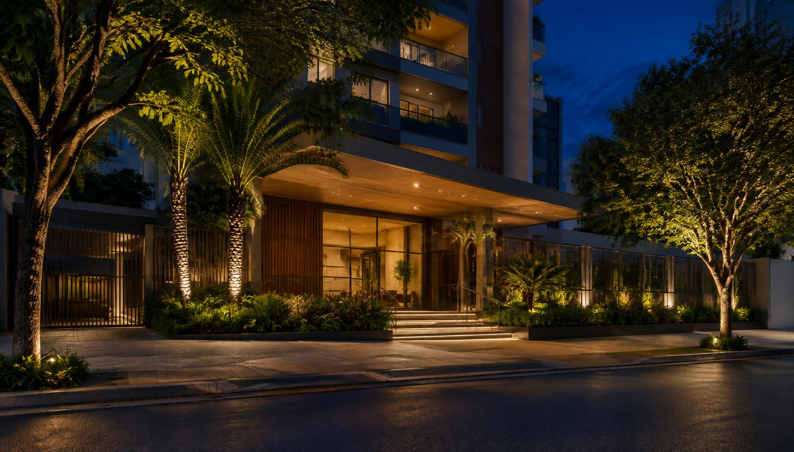 Entrada sofisticada de edifício residencial à noite